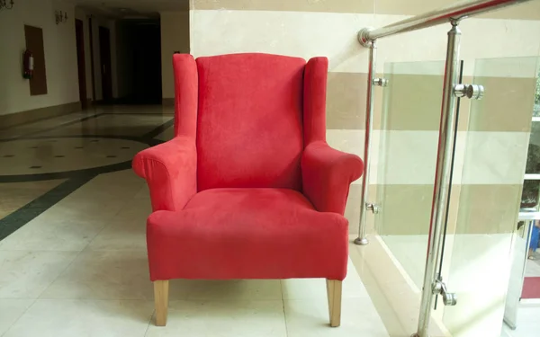 Red armchair  in the hotel royal front