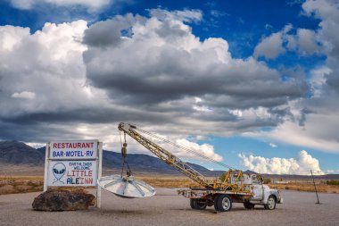 Old pickup truck with an object similar to UFO in Rachel, Nevada clipart