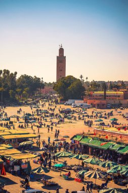 View of the busy Jamaa el Fna market square in Marrakesh, Morocco clipart