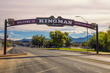 Welcome to Kingman downtown street sign located on historic route 66 clipart