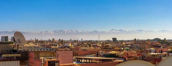 Panorama of Marrakech city skyline with Atlas mountains in the background