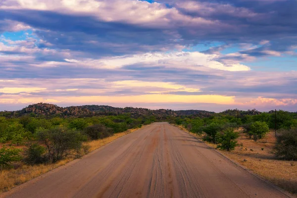 Sunset over the gravel road C35 in Damaraland, Namibia — Stock Photo, Image