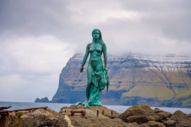 Statue of Selkie or Seal Wife in Mikladalur, Faroe Islands clipart