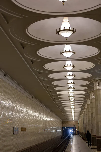 Decorative ceiling with lamps in the Moscow subway. Russia