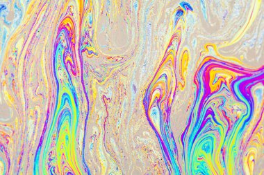 Rainbow colors created by soap, bubbles, or oil with vertical messy smudges. clipart
