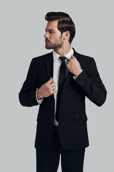 Confidence and charisma. Handsome young man in full suit adjusti — Stock Photo, Image