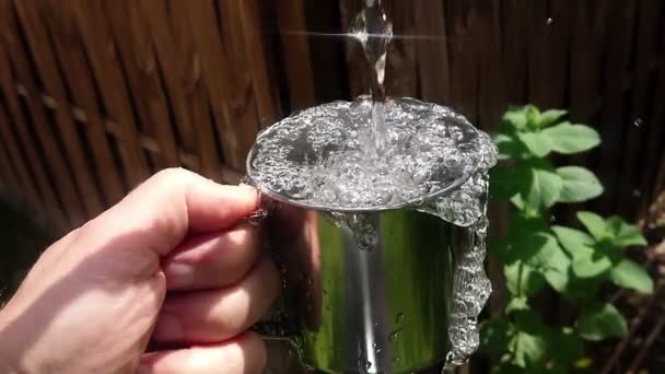 Crystal Clean Water Poured Metal Cup Hand Slow Motion Water — Stock Video