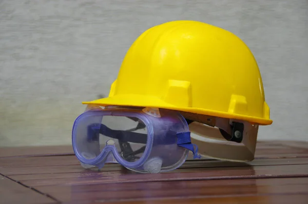 Helmet and safety glasses. Industrial personal protection equipment.