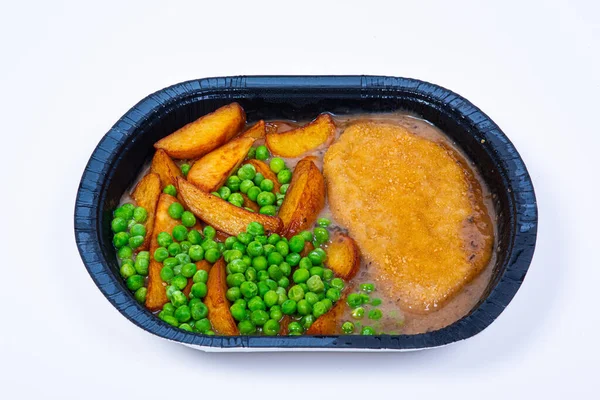 Freezer meal with peas, potatoes and wiener schnitzel.