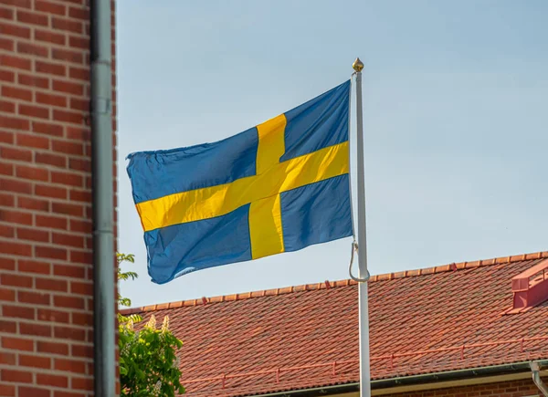 Swedish flag on a flag pole