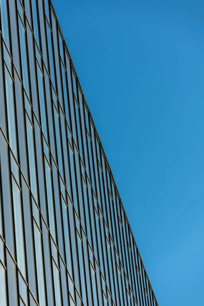 windows of a newly built large office building.