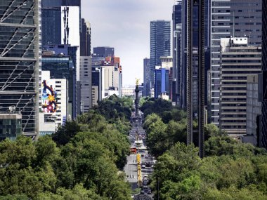 Mexico City, Mexico - Oct 21 2018: View of Paseo de la Reforma nested between skyscrapers in Mexico City clipart