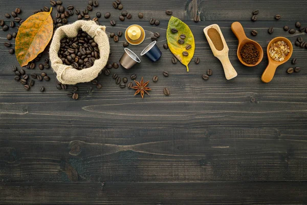 Coffee beans ,coffee capsule and coffee powder on dark wooden ba — Stock Photo, Image