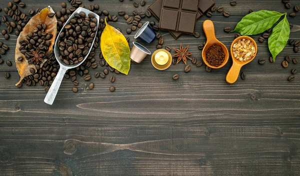 Coffee beans ,coffee capsule and coffee powder on dark wooden ba — Stock Photo, Image