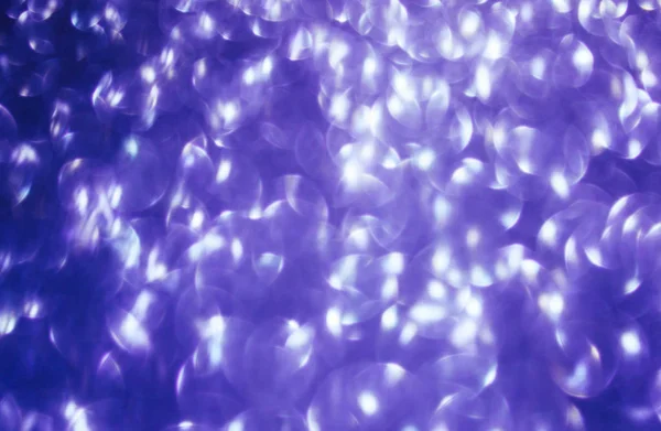 Ultraviolett abstrakt bokeh bakgrund. — Stockfoto