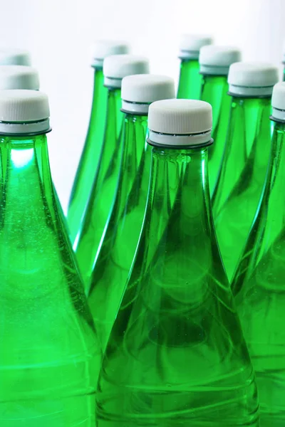 Green Sparkling Water Bottle White Caps Objects Studio Lighting Isolated Royalty Free Stock Photos