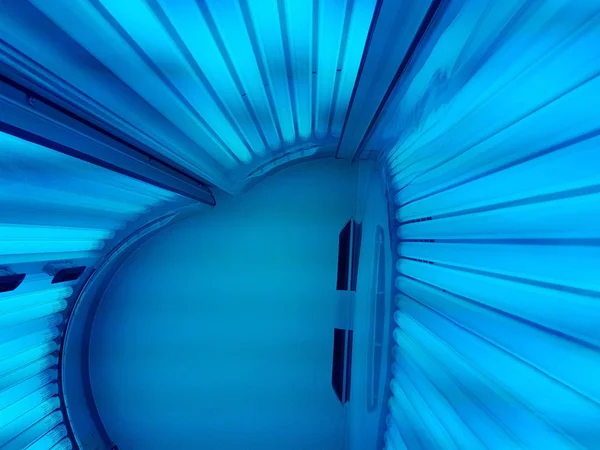 ultraviolet blue lamps in the tanning booth