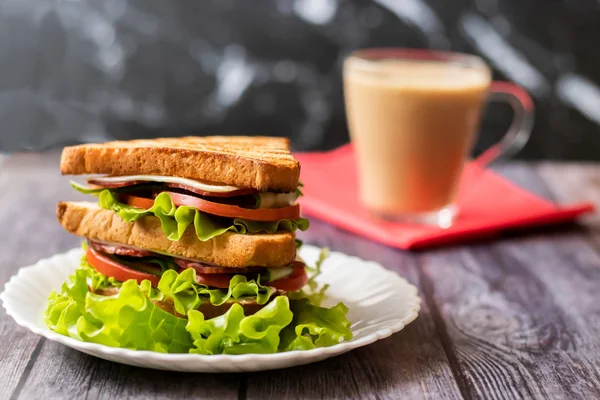 Sandwich with cheese, tomato, cucumber, sausage and salad on wooden background. Coffee with milk Horizontal orientation — Stock Photo, Image