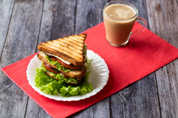 Sandwich with cheese, tomato, cucumber, sausage and salad on wooden background. Coffee with milk Horizontal orientation — Stock Photo, Image