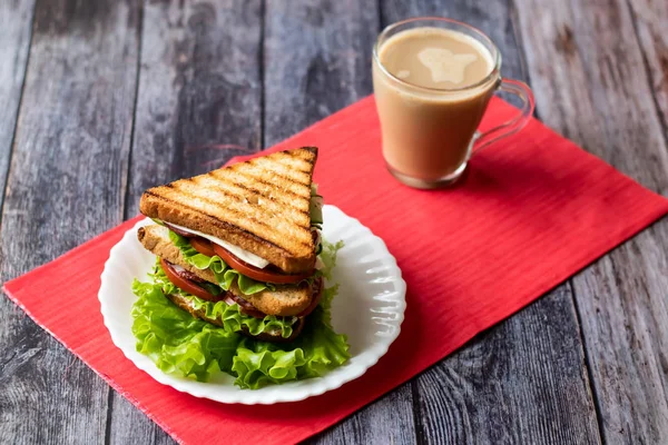 Sandwich with cheese, tomato, cucumber, sausage and salad on wooden background. Coffee with milk Horizontal orientation — Stock Photo, Image