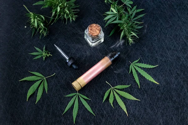 Vape CBD or THC, Vaping Marijuana and Hemp. Against a Dark Background. Horizontal orientation — Stock Photo, Image