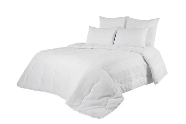 White coverlet or bedspread with four pillows isolated. White bedlinen on the bed. — Stock Photo, Image