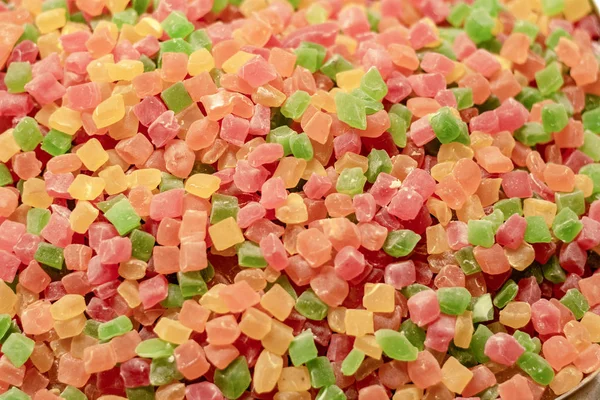 Cube confectionery. Covered with sugar in different colors. The granular structure there was filmed in front of the store.