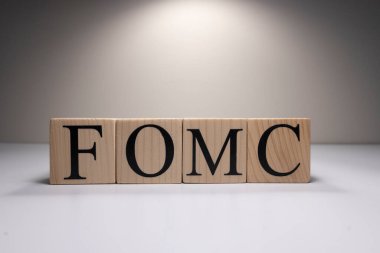 FOMC Meeting Minutes word over Candlestick chart Forex background. clipart