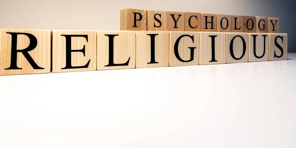 Religious psychology text from wooden cubes. The term psychology profession.