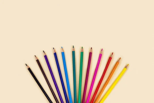 Colored pencils on yellow background. — Stock Photo, Image