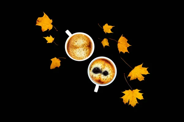 Coffee with maple leaves on black background. — 스톡 사진