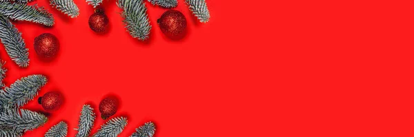 Christmas background with red balls on fir brunches. — Stock Photo, Image