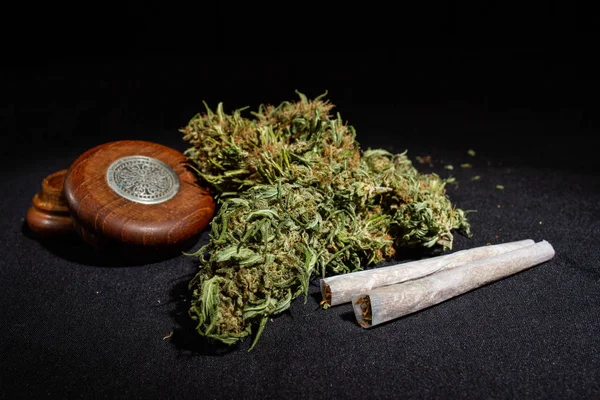 Marijuana bud with pores and grinder — Stock Photo, Image