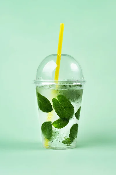 Iced Tea In Plastic Cup With Lemon And Mint Stock Photo, Picture