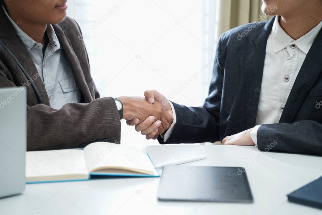 Close up of two executive businessmen hands shake, hr hiring and new job, making corporate successful business deal, professional agreement, partnership and teamwork handshake concept