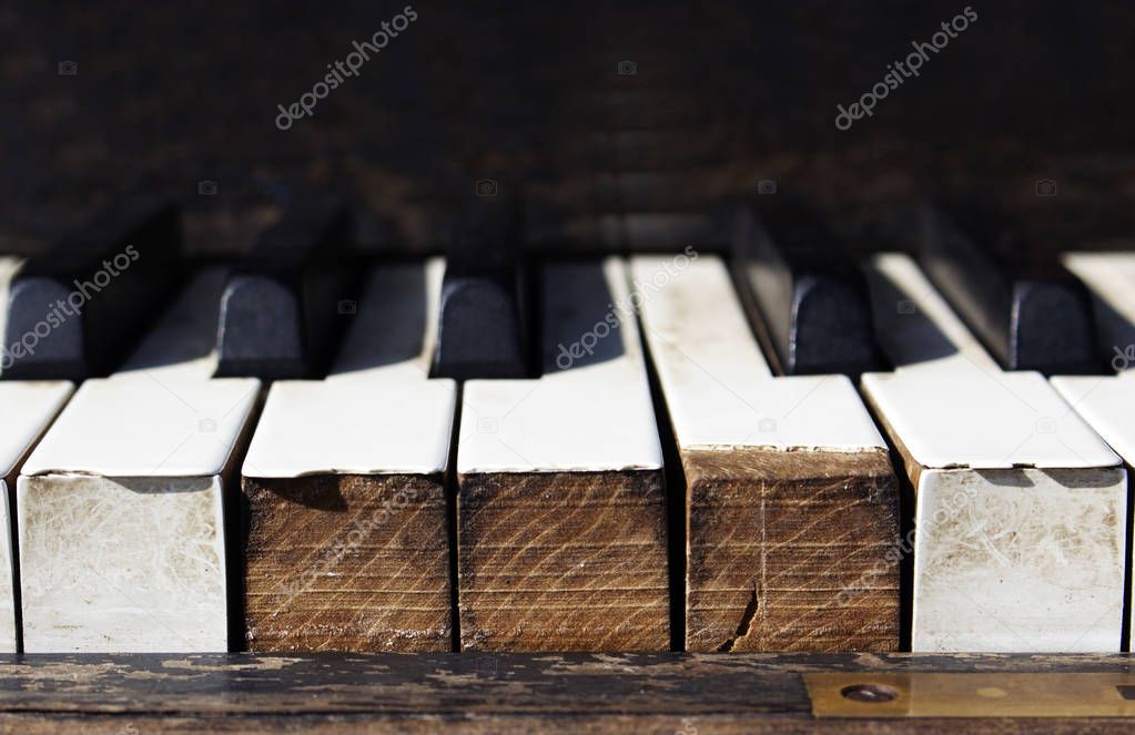 Close up old piano keys.