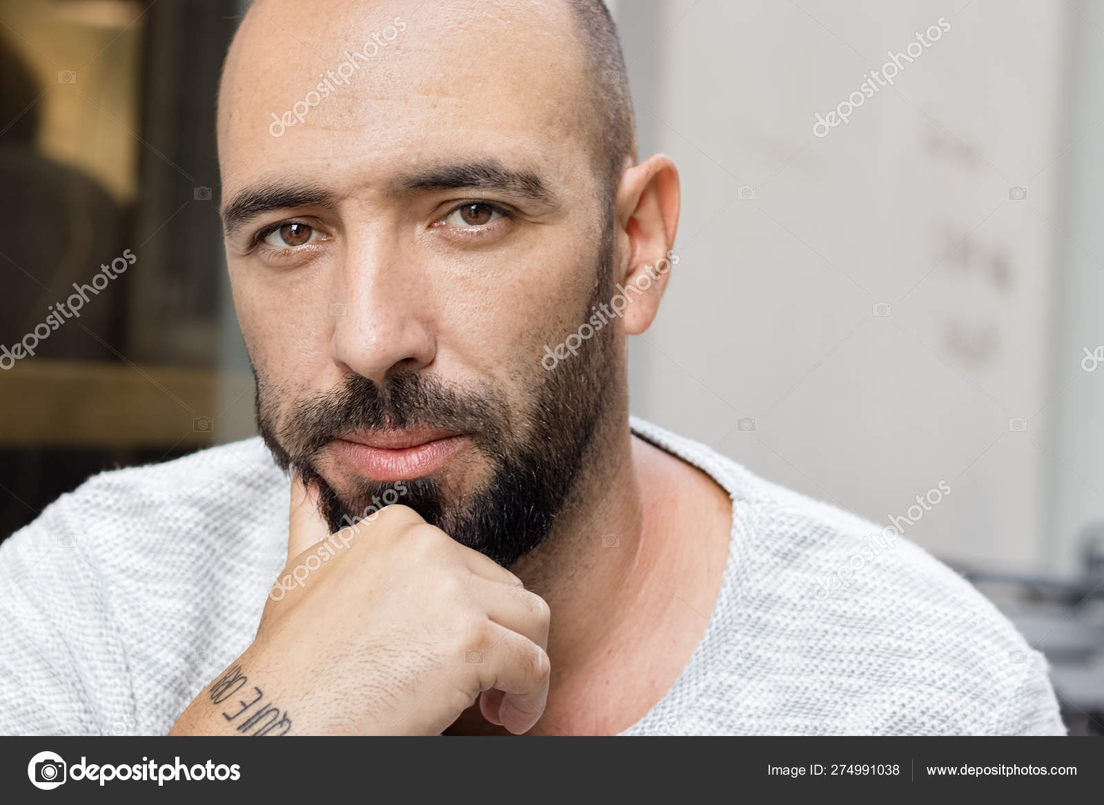 Portrait Of A Man With Beard And Short Buzz Hair Cut Looking