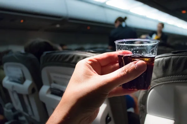 A cold drink and a sandwich flying in economy class. — Stock Photo, Image