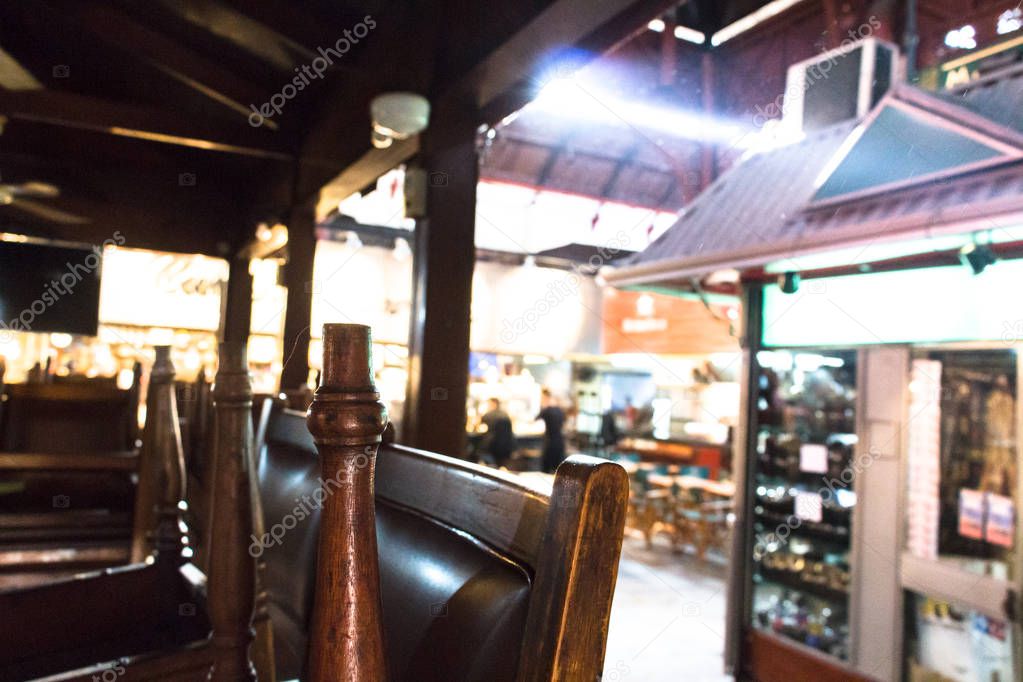 Closed Restaurant with chairs upside at the Mercado Del Puerto, 