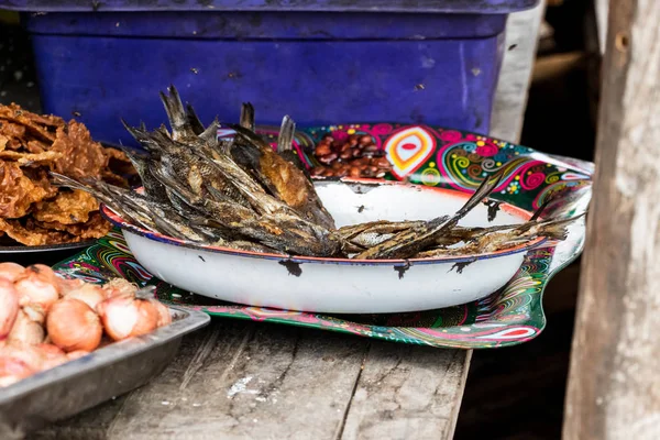 A metallic tray with fried fish to be sold at the food market in Andavadoaka, Madagascar.