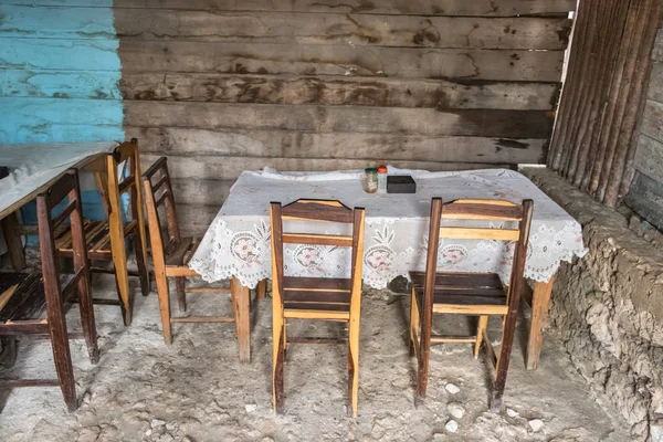 Wooden chairs and table in a rustic restaurant in Andavadoaka, Madagascar.
