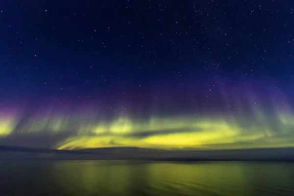 Northern Boreal Lights at sea in Lady Richardson Bay, Victoria Island, the northwest passage in Canada.