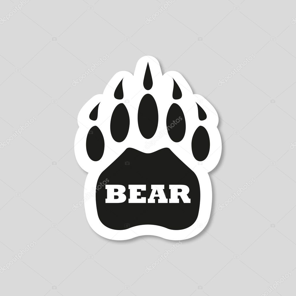 Sticker with shadow bear footprint on gray background, vector