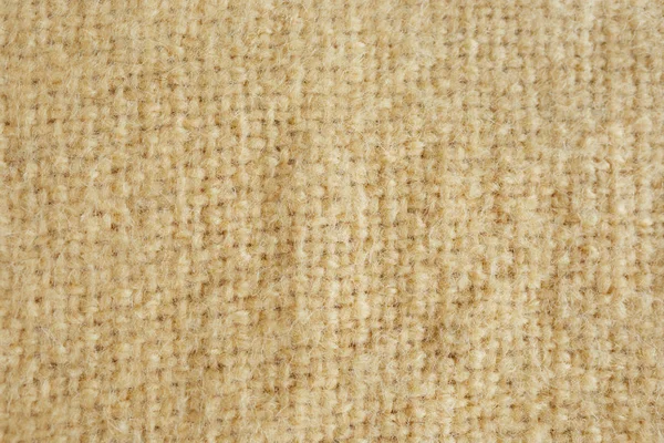 柔软的毛皮黄色地毯的背景图片。羊毛羊毛羊毛特写纹理背景。假颜色黄色毛皮织物。顶部视图 — 图库照片