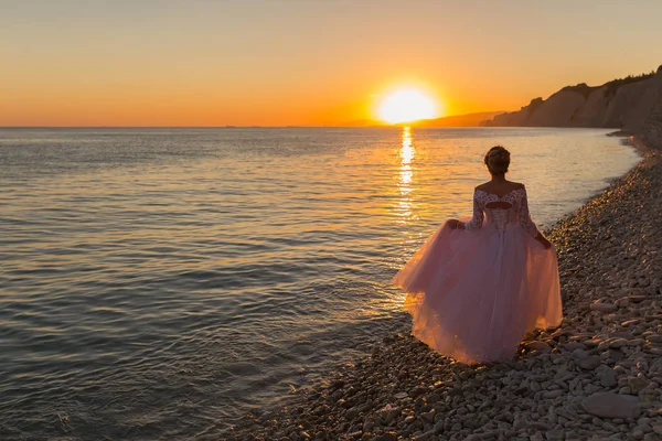 Bride white wedding dress stand on the beach. Wedding dress. Bride happy enjoy sunset sea background. Evening ceremony. Honeymoon at sea resort. Wedding ceremony seashore — Stock Photo, Image