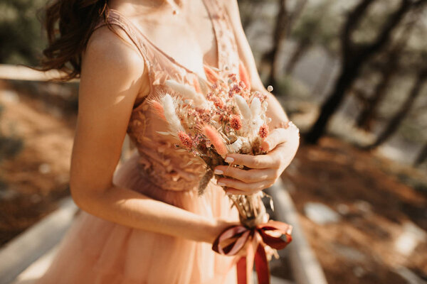 Bouquet in the hands of the bride.