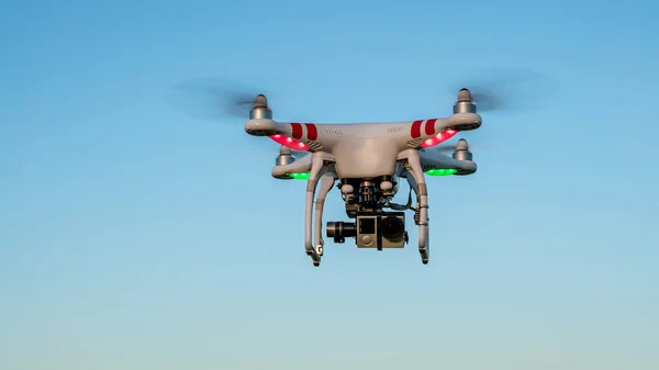 View of drone flying with digital camera and blue sky background