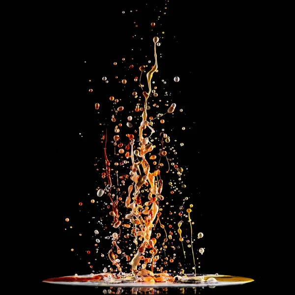 Splash of acrylic paint, multicolored paints explosion, abstract background on black — Stock Photo, Image