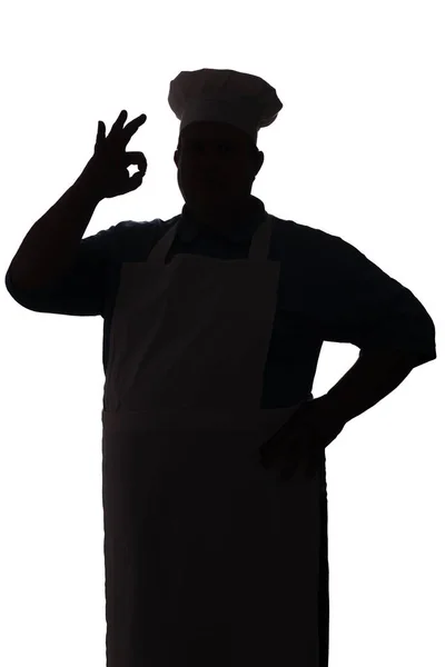一个快乐的厨师在白色孤立的背景剪影，男性手显示确定 — 图库照片