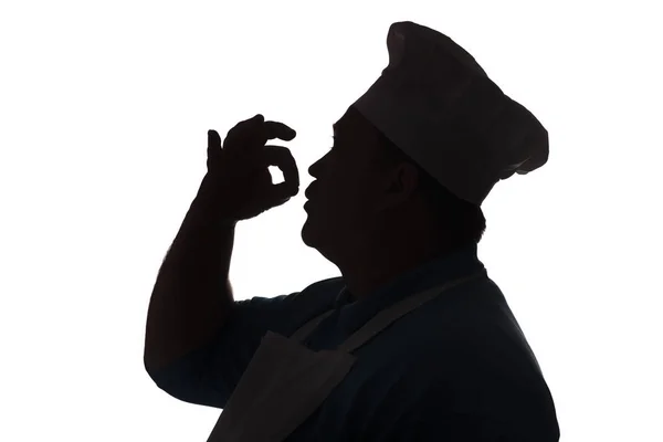 Sziluettje egy boldog szakács egy fehér elszigetelt háttér, profilja a férfi arca egy szakács kalap, élelmiszeripari koncepció — Stock Fotó